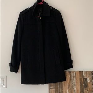 Winter coat that is black with a gold zipper.